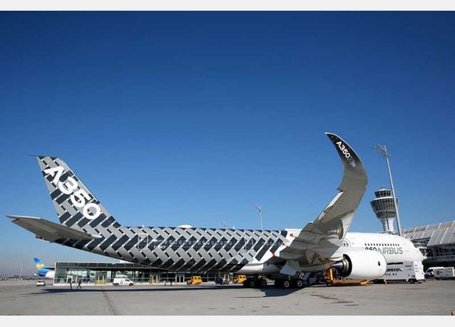 A new Airbus A350X WB passenger plane stands on the tarmac at Munich Airport during a presentation of the new plane by Airbus officials on February 27, 2015 in Munich, Germany. The A350 is a long-distance passenger plane that Airbus has developed to compete against the Boeing 787 Dreamliner. (Getty Images) IN PHOTOS: Lufthansa and Airbus present new A350 plane