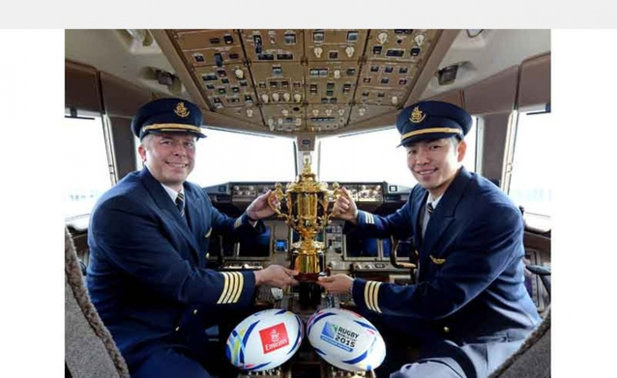 Emirates Captain, Jason Scattergood (England) and Emirates First Officer, Tomohisa Kitano (Japan), with the Web Ellis Cup which is awarded to the winner of the RWC. Emirates Captain, Jason Scattergood (England) and Emirates First Officer, Tomohisa Kitano (Japan), with the Web Ellis Cup which is awarded to the winner of the RWC.