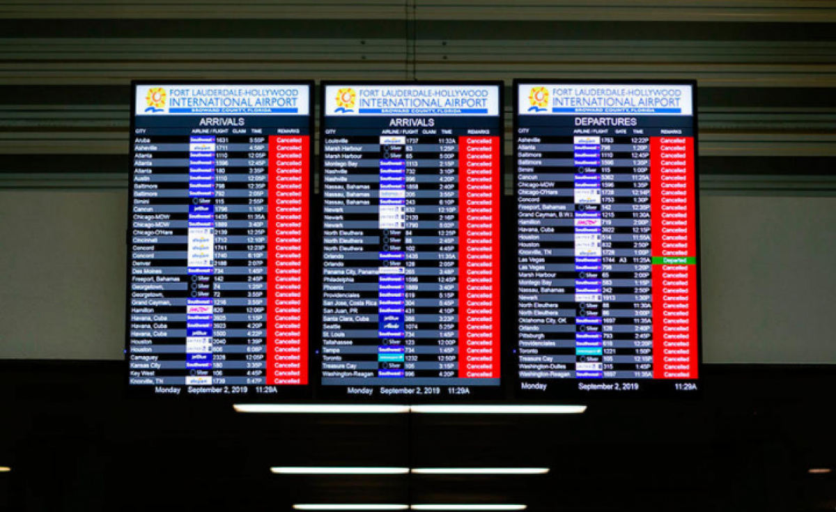 An information board displaying canceled flights is seen in the departure hall at Fort Lauderdale-Hollywood International Airport in Fort Lauderdale An information board displaying canceled flights is seen in the departure hall at Fort Lauderdale-Hollywood International Airport in Fort Lauderdale