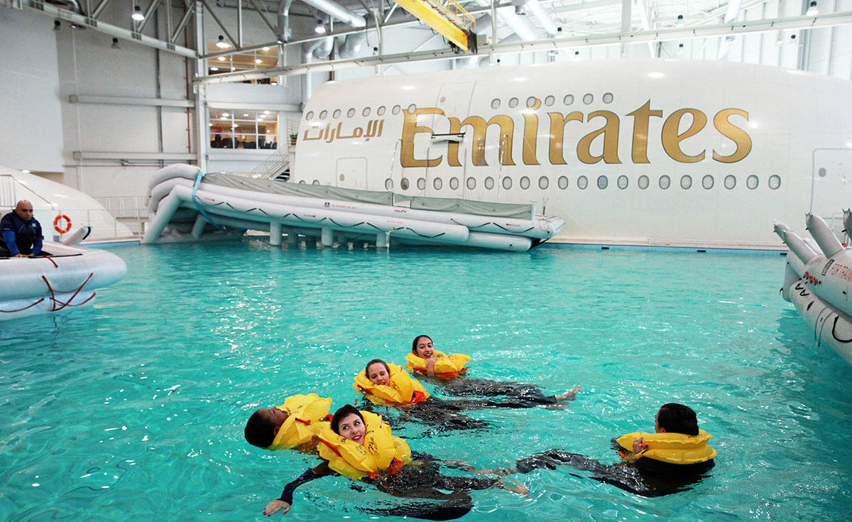 Emirates cabin crew trainees practise safety and emergency procedures Emirates cabin crew trainees practise safety and emergency procedures